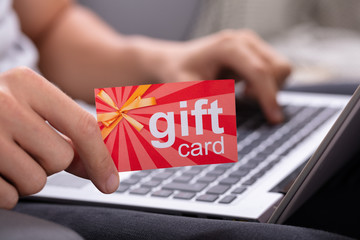 Man Holding Red Gift Card