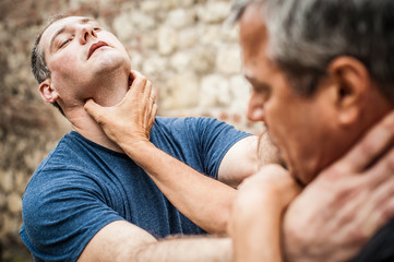 Kapap instructor demonstrates street fighting self defense techniques. Martial arts