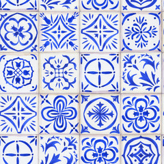 Seamless composition with floral ornament - vintage ceramic tiles in azulejo design with blue elements on white background. Watercolor hand drawn painting illustration.