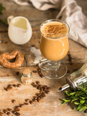 coffee in a transparent mug (with milk and spices). Top view. copy space