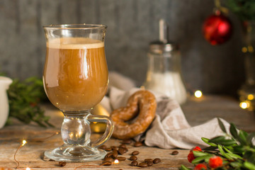 coffee in a transparent mug (with milk and spices). Top view. copy space