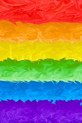 Motion blurred picture of a gay rainbow flag during pride parade. Concept of LGBT rights.