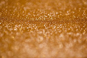 Defocused abstract golden christmas background with blinking lights