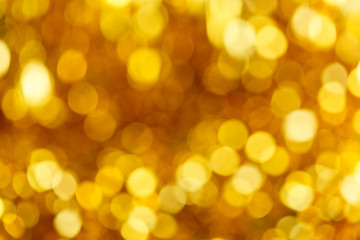 Defocused abstract golden christmas background with blinking lights