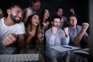 Fototapeta premium happy business team looking at computer monitor