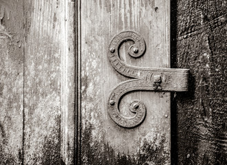 Close-up view at door hinge with mold . Image in black and white color style