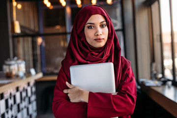 Islamic businesswoman in hijab at coffee shop
