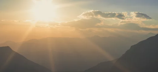 Selbstklebende Fototapeten Cappuccino beautiful morning sun rise mountain silhouettes nature panorama landscape   © Artem Kniaz