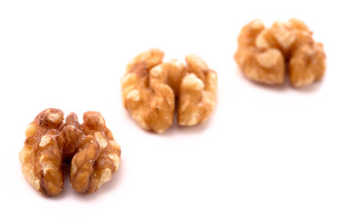 Line of Healthy Walnuts on a White Background
