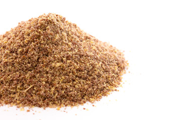 Pile of Ground Flax Seeds on a White Background