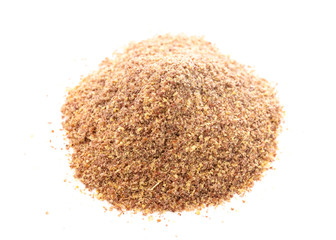Pile of Ground Flax Seeds on a White Background