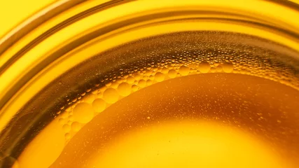 Küchenrückwand glas motiv Yellow oil bubbles on water, cooking oil background. © venars.original