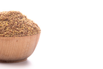 Wooden Bowl Full of Ground Flax Seeds on a White Background