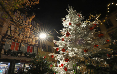 Traditional Alsatian half-timbered houses in old town of Colmar, decorated for christmas time,...