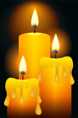 Three burning candle on the dark background . The magical atmosphere of Christmas night 