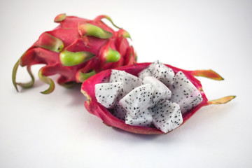 Exotic ripe white Pitaya or Dragon fruit. Red Pitahaya tropical fruit cut in cubes on white background