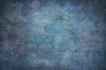 Fototapeta na wymiar Blue painted canvas or muslin fabric cloth studio backdrop or background