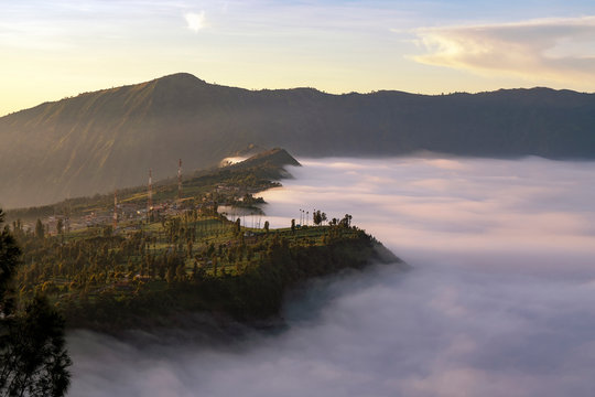 Low clouds over Cemoro Lawang at sunrise, Bromo Tengger Semeru National Park, East Java, Indonesia