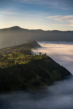 Low clouds over Cemoro Lawang at sunrise, Bromo Tengger Semeru National Park, East Java, Indonesia