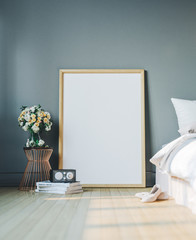 Cozy bedroom with empty poster frame. Frame mockup in interior.