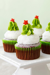 Christmas decorated red velvet cupcakes on a cakestand