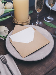 Envelope with an elegant wedding invitation. Place card mockup.