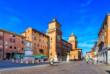 Castle Estense (Castello Estense) and piazza Savonarola and monumet to Savonarola in Ferrara, Emilia-Romagna, Italy. Ferrara is capital of the Province of Ferrara - obrazy, fototapety, plakaty
