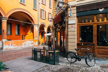 Naklejka na ściany i meble Old narrow street in Bologna, Emilia Romagna, Italy