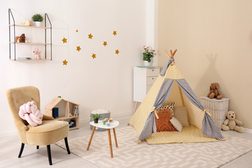 Cozy kids room interior with play tent and toys