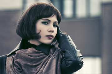 Beautiful fashion woman walking on city street