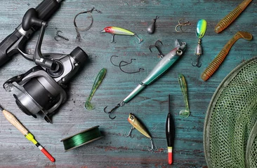 Foto op Plexiglas Flat lay composition with fishing equipment on wooden background © New Africa