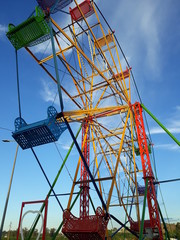 ferris wheel on background of blue sky