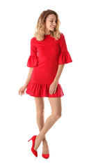 Young woman with beautiful long legs in stylish outfit on white background