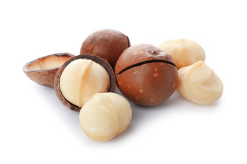 Pile of organic Macadamia nuts on white background