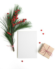 Christmas card background template with pine cones and tree on the table isolated top view. Styled new year flat lay. Mock up paper for display with copy space for text. Holiday preparation