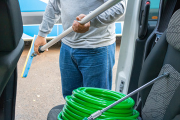 Cleaner manwith your tools. Conceptual image of car washing job.