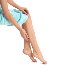 Obraz na płótnie Canvas Woman with beautiful legs and feet on white background, closeup. Spa treatment