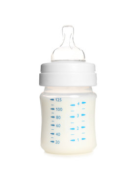 Baby bottle with milk on white background