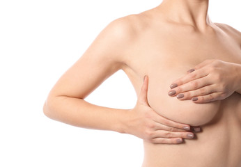 Naklejka premium Woman checking her breast on white background, closeup