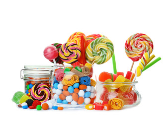 Composition with many different yummy candies on white background