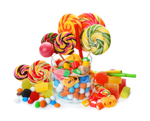Composition with many different yummy candies on white background