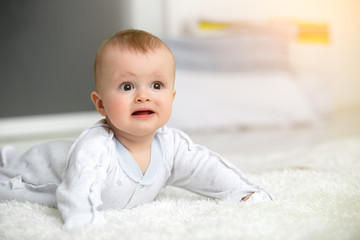 infant baby boy crawl with towel