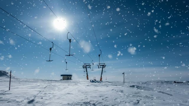 Soft snow falls on the top of the ski base, a beautiful winter landscape, video loop
