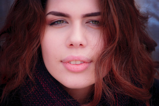 Winter portrait of a beautiful young woman. Close up.