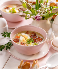 The sour soup (Żurek), polish Easter soup with the addition of smoked  sausage and a hard boiled...