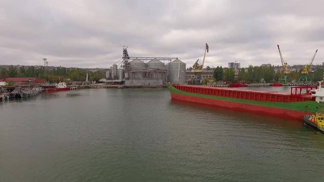 4K - To follow the cargo ship. Aerial view