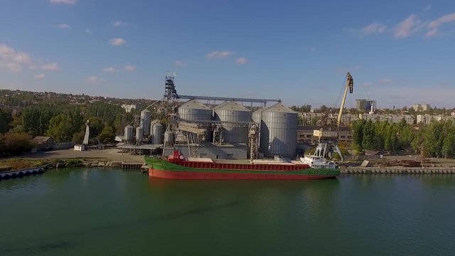 4K - To follow the cargo ship. Aerial view
