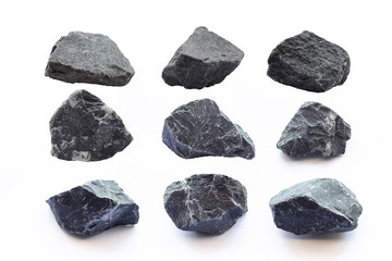 9 Black stone on white background. Different rock.