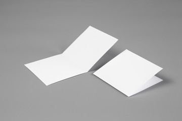 Blank portrait mock-up paper. brochure magazine isolated on gray, changeable background / white paper isolated on gray