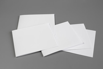 Blank portrait mock-up paper. brochure magazine isolated on gray, changeable background / white paper isolated on gray